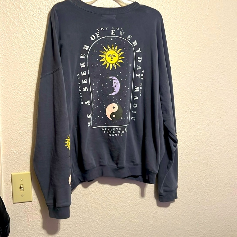 Graphic sweater (graphic is on the back) for women.